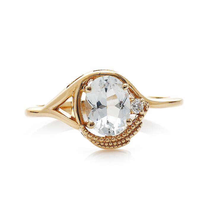 Золотое кольцо со светло голубым топазом и бриллиантом
